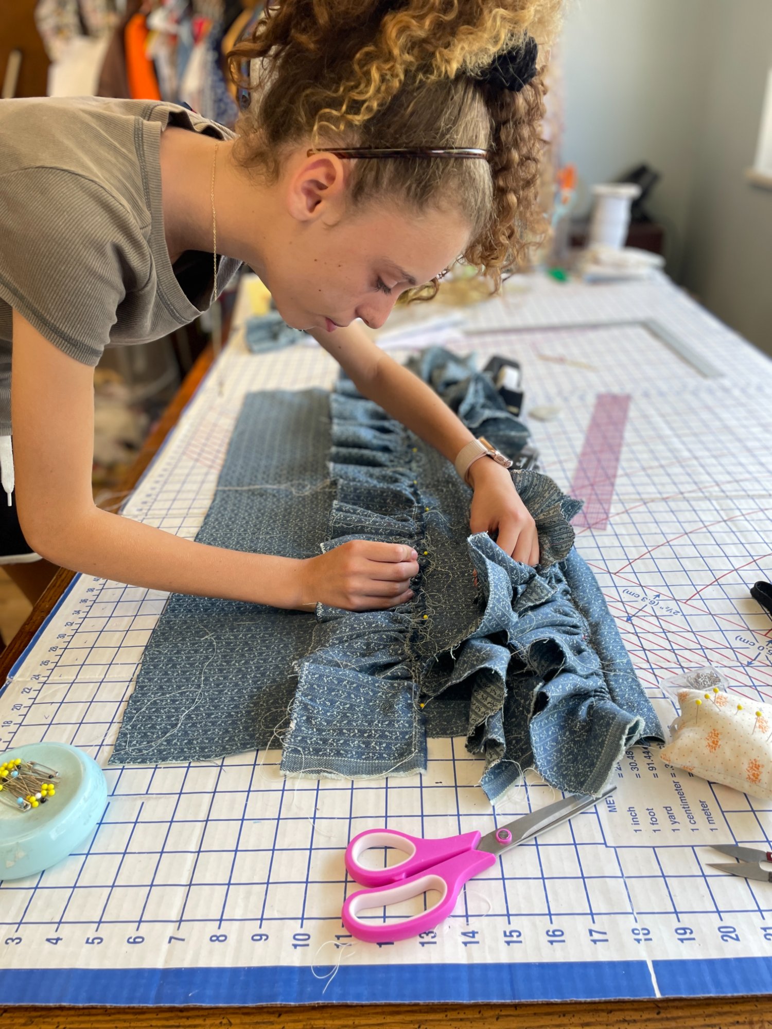 Teen working with fabric